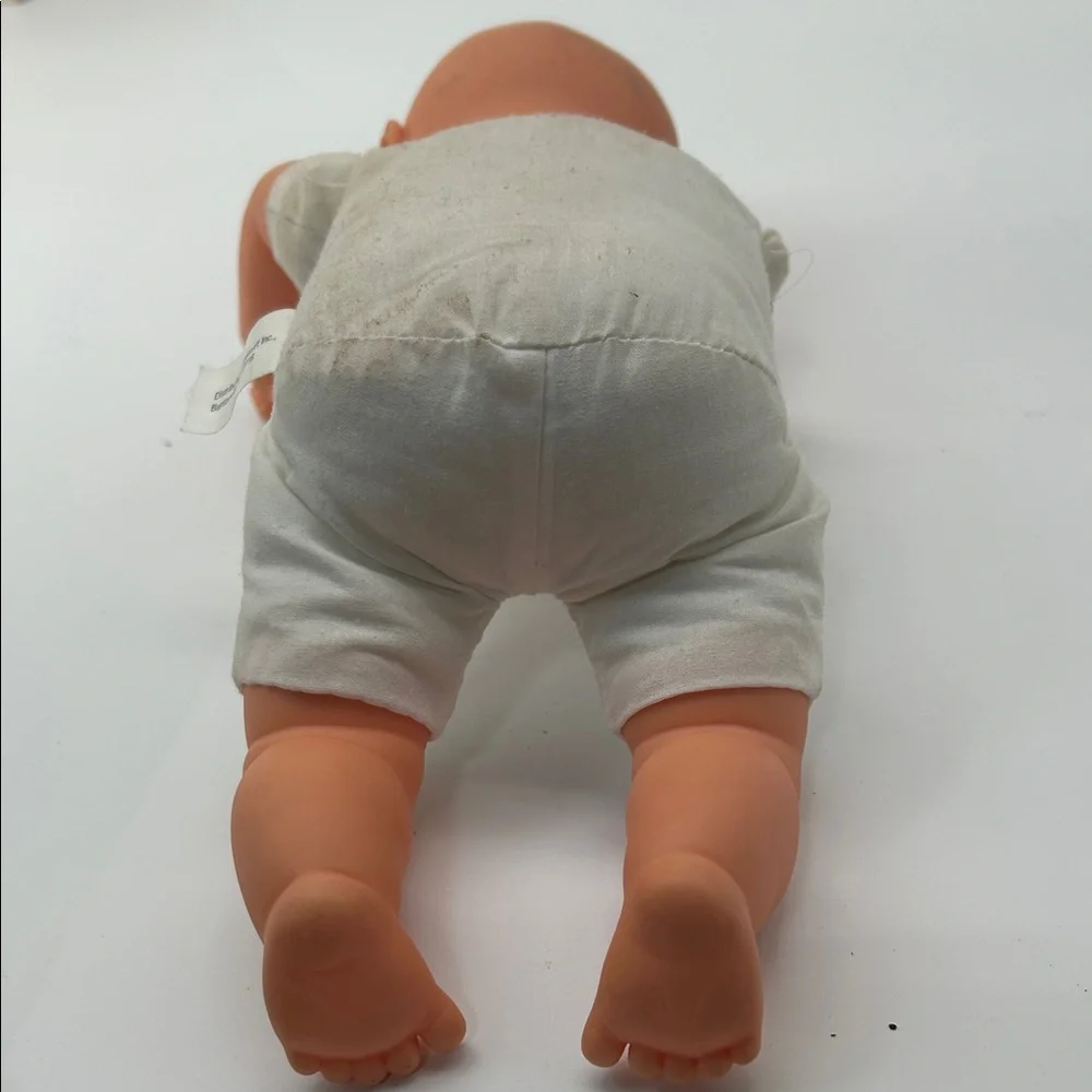 Realistic Baby Doll with White Outfit